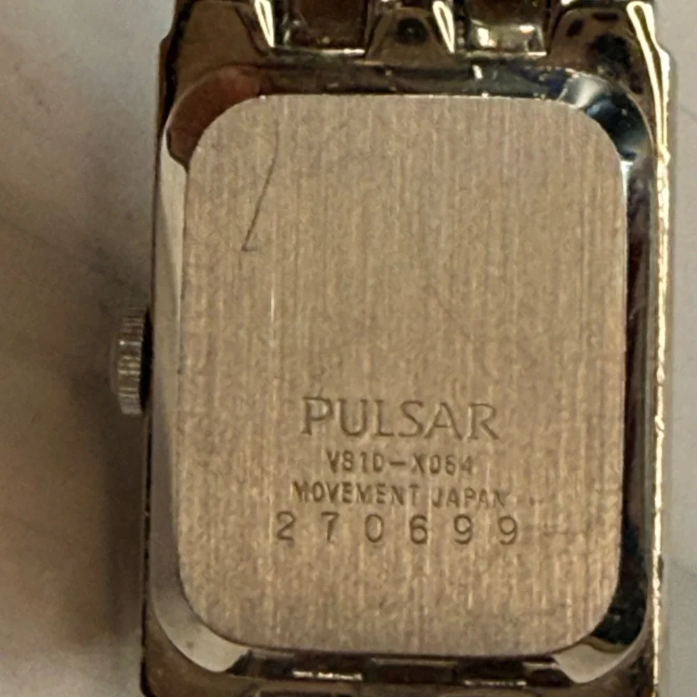 Pulsar Womens Silver Tone Crystal Bezel Black Dial Dress Watch V810-X064